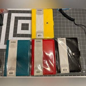 New/neverused 4 pc lot, leatherette journals. Wrapped in original plastic!